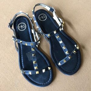 New! Black and goldtone studded slingback sandal.